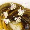 lot d'épingles à cheveux avec des petits papillons blancs