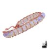 Bracelet jonc rigide Stella en cuivre naturel poli orné de perles rondelles en opalite aux reflets laiteux et lunaires, style féerique.