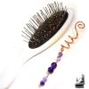 Épingle à cheveux spirale artisanale en cuivre de style celtique ornée de perles d'améthyste du Trésor des Korriganes.