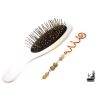 Épingle à cheveux spirale artisanale en cuivre de style celtique ornée de perles de labradorite aux reflets irisés du Trésor des Korriganes.