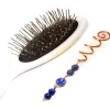 Épingle à cheveux spirale artisanale en cuivre de style celtique ornée de perles de lapis-lazuli aux éclats bleus du Trésor des Korriganes.