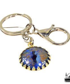 Porte-clé artisanal "Œil de Dragon" Pyros en métal argenté avec motif peint à la main, création unique de la boutique Le Trésor des Korriganes.