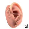 Paire d'ear cuffs elfiques en cuivre pur tissé sans perçage, sculptés en volutes par Le Trésor des Korriganes.